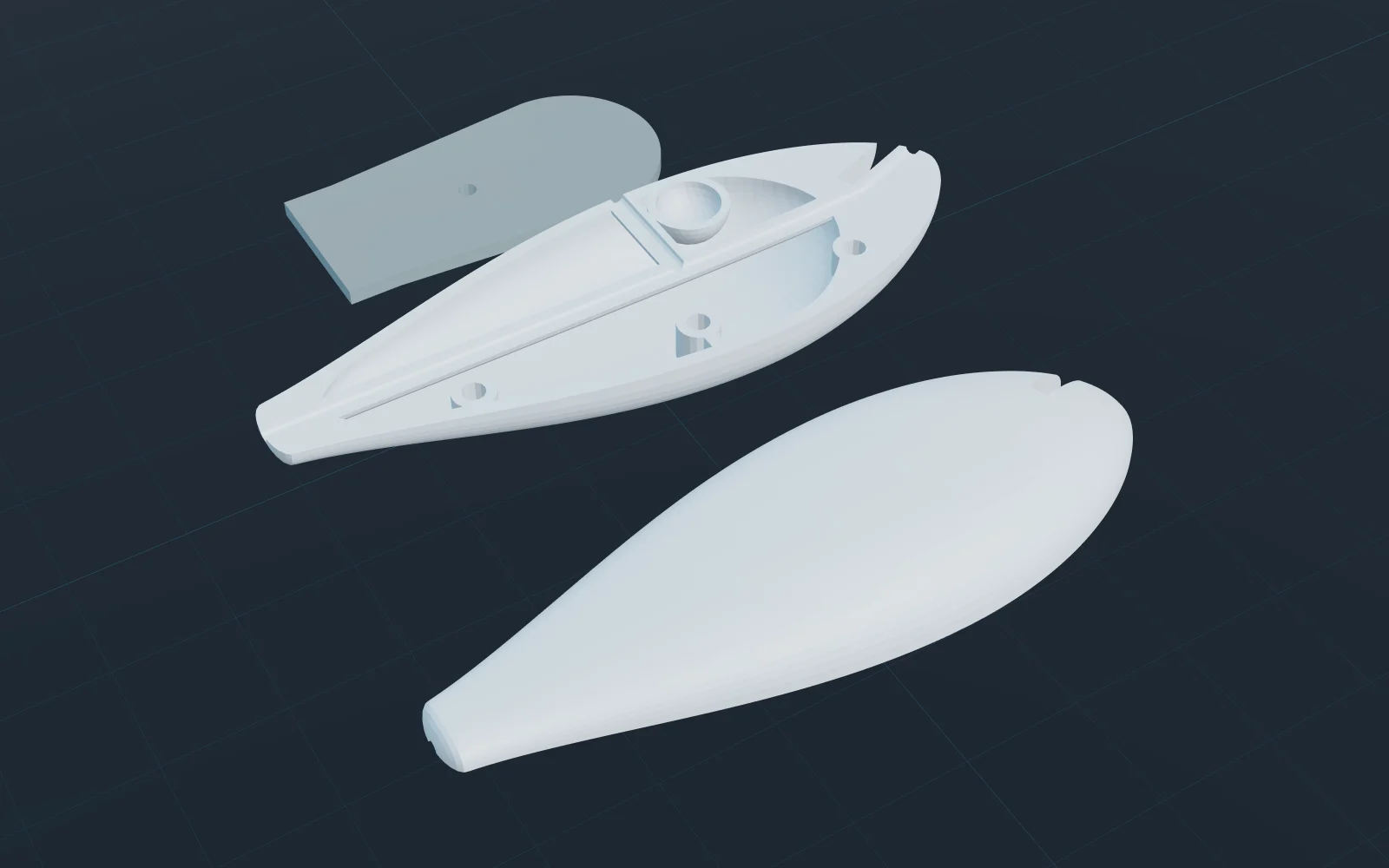 The exported print parts of a deep-diving crankbait on a print bed: one shell half seen from the outside, the other flipped to show the ballast pocket, wire channel and pin holes, and the separate bill